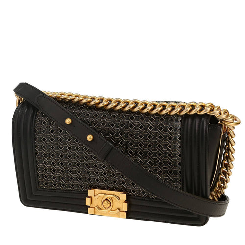 Chanel Boy shoulder bag in black and gold braided leather